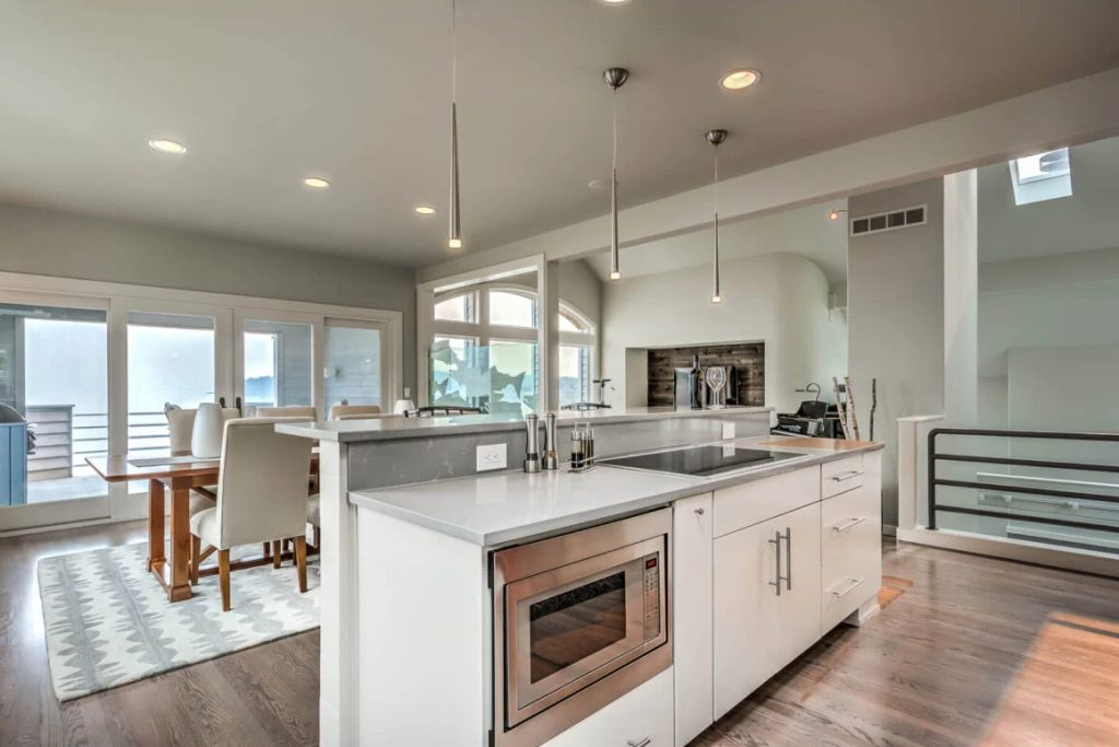 Open concept kitchen island with stove represents a modern and versatile approach to kitchen design, offering a range of advantages