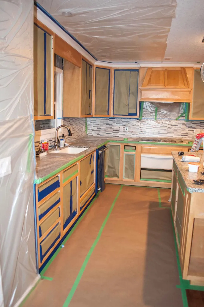 Spraying kitchen cabinets can be a fantastic way to achieve a professional, smooth finish while saving time and